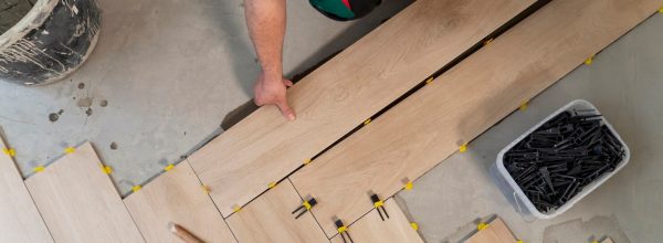 top-view-man-tiling-floor_23-2149344001